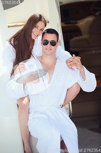 Image of young couple on yacht