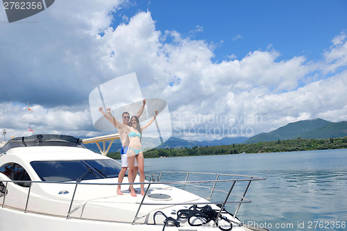 Image of young couple on yacht