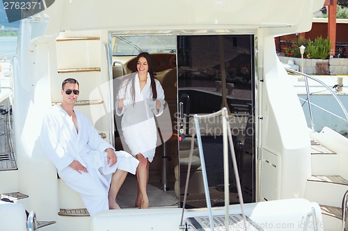 Image of young couple on yacht