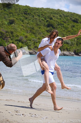 Image of photographer taking photo on beach