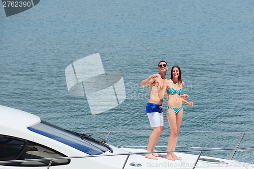 Image of young couple on yacht