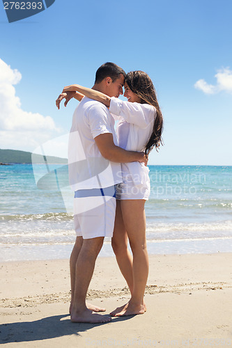 Image of happy couple have fun on the beach