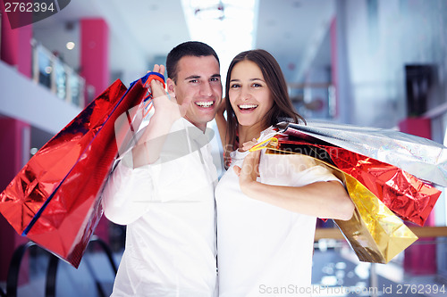 Image of happy young couple in shopping