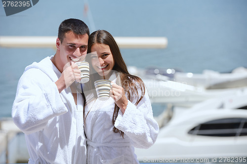 Image of young couple on yacht