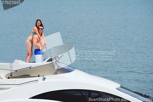 Image of young couple on yacht