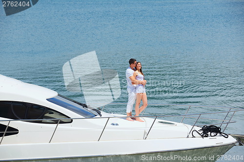 Image of young couple on yacht