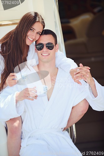 Image of young couple on yacht