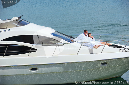 Image of young couple on yacht