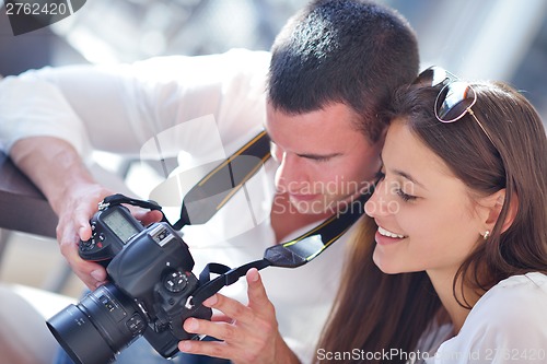 Image of couple looking photos on camera