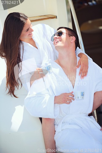 Image of young couple on yacht