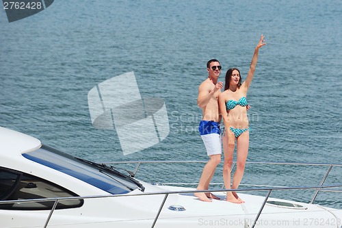 Image of young couple on yacht