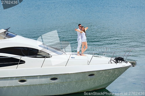 Image of young couple on yacht