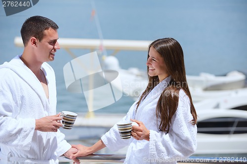 Image of young couple on yacht