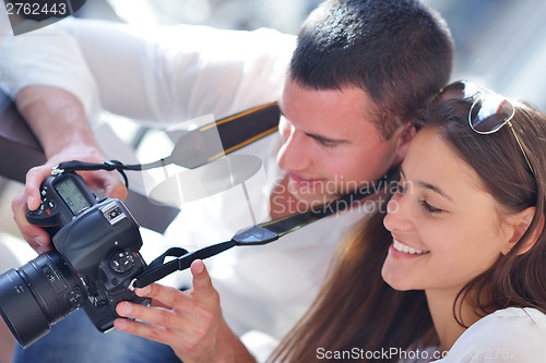 Image of couple looking photos on camera