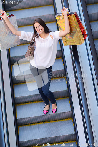 Image of happy young couple in shopping