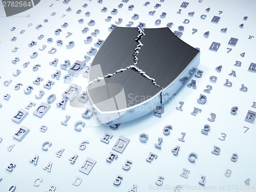 Image of Security concept: silver broken shield on digital background