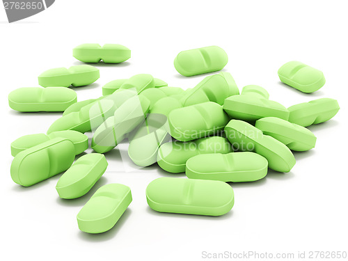Image of Green pills on white background