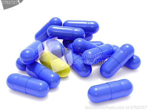 Image of Blue and yellow pills on white