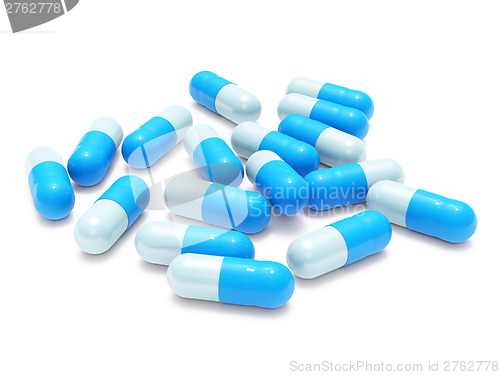 Image of Many blue-gray pills on white