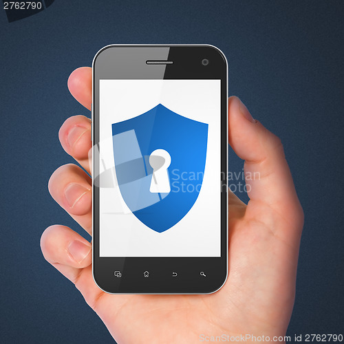 Image of Safety concept: smartphone with Shield Keyhole.