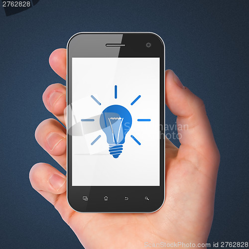 Image of Finance concept: smartphone with Light Bulb.