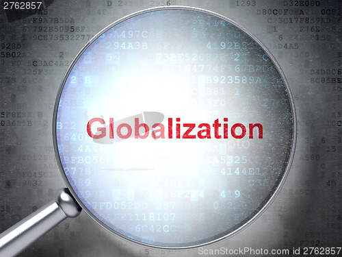 Image of Magnifying optical glass with words Globalization on digital bac