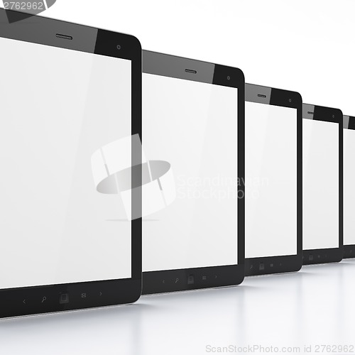 Image of Black tablets on white background