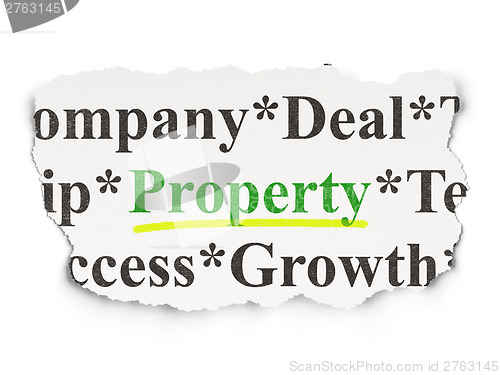 Image of Torn newspaper with words Property on  background