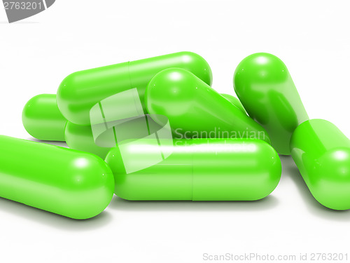 Image of Many green shiny medical pills (capsule)