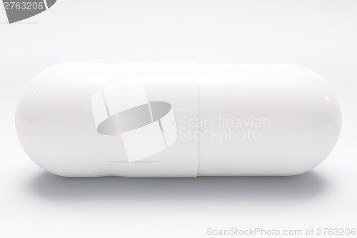 Image of White medical pill on white background