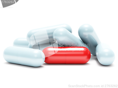 Image of Many white and one red shiny pills (medical capsule)