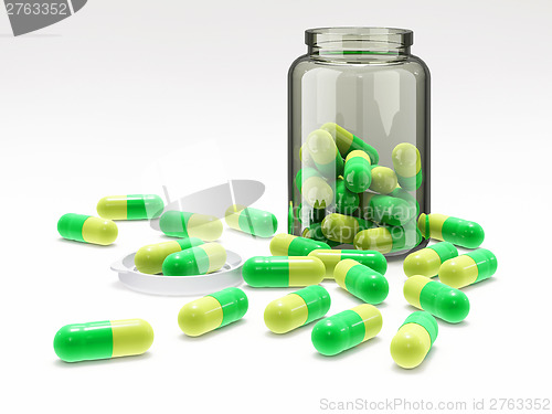 Image of Green-yellow pills in medical bottle with cap