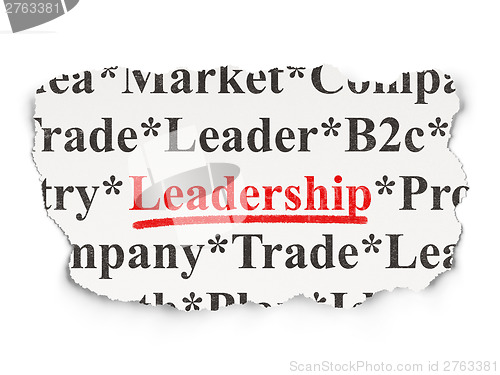Image of Torn newspaper with words Leadership on  background