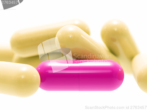 Image of Pink and beige pills on white