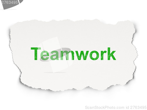 Image of Torn paper with words Teamwork on  background