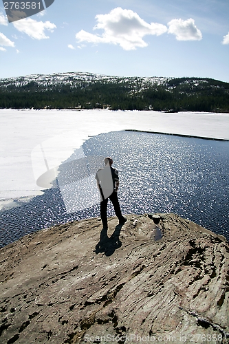 Image of Man by a lake