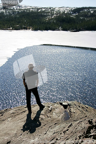 Image of Man by a lake