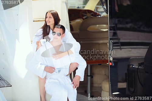 Image of young couple on yacht