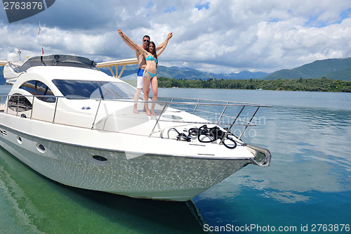 Image of young couple on yacht