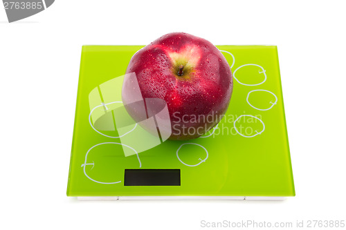 Image of Red apple on scales