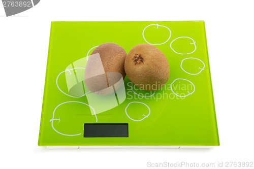 Image of Two kiwi fruit on scales