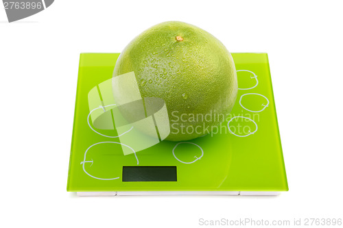 Image of Sweetie fruit on square kitchen scales