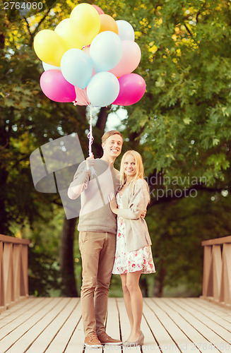 Image of couple with colorful balloons