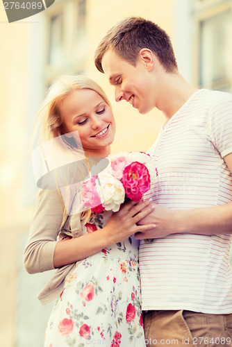 Image of couple with flowers in the city