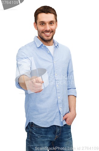 Image of smiling man pointing finger at you