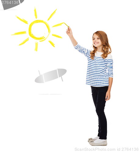 Image of girl drawing big sun in the air
