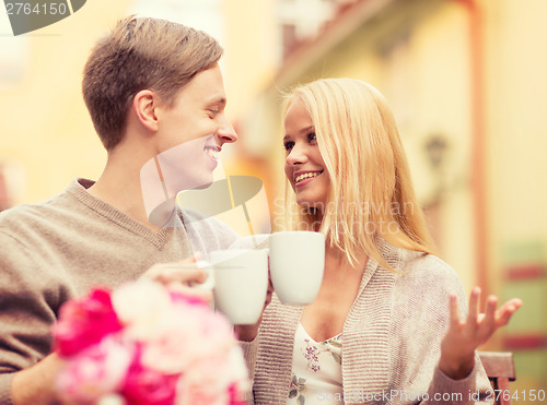 Image of romantic happy couple in the cafe