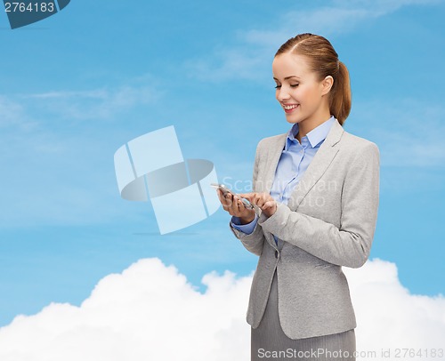 Image of young smiling businesswoman with smartphone