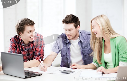 Image of students chatting in lecture at school