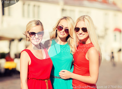 Image of three beautiful women in the city